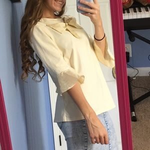 dainty jewell’s cream top with bow